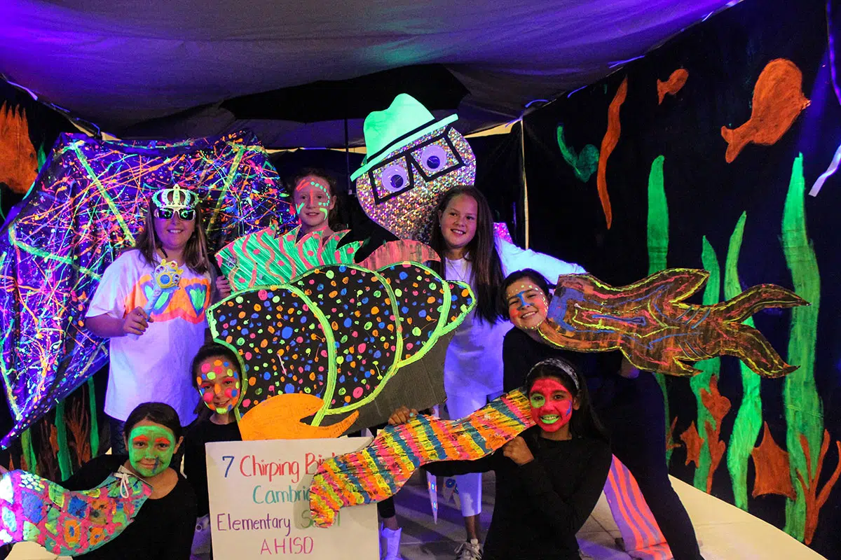 Students posing for a photo at a Destination Imagination tournament