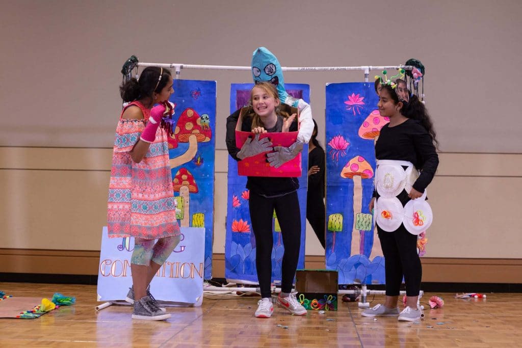 Students participating in a challenge during a Destination Imagination tournament