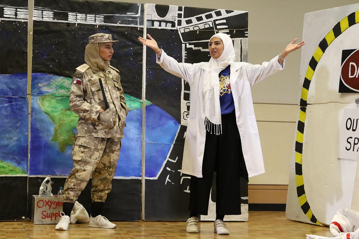 Students participating in a challenge during a Destination Imagination tournament