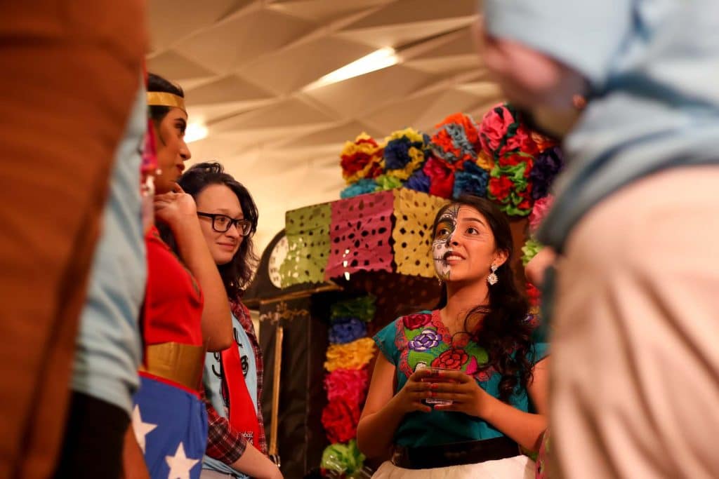 Photo of a student talking to a tournament official at a Destination Imagination tournament