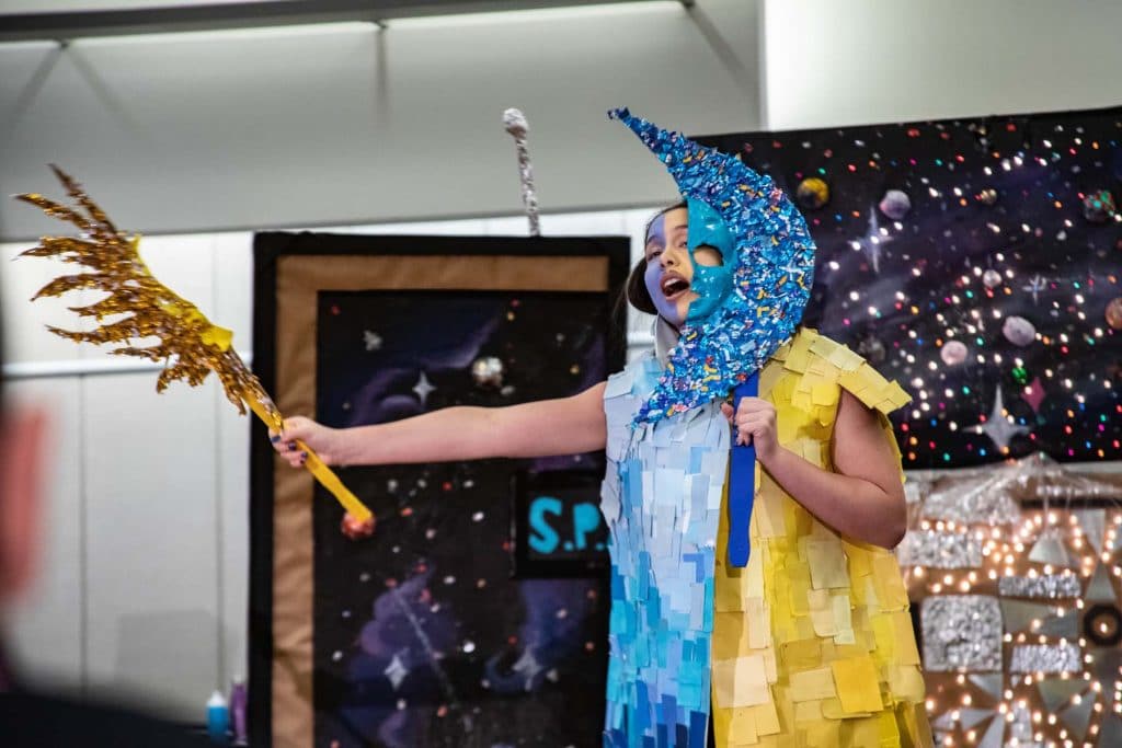 Student participating in a challenge during a Destination Imagination tournament