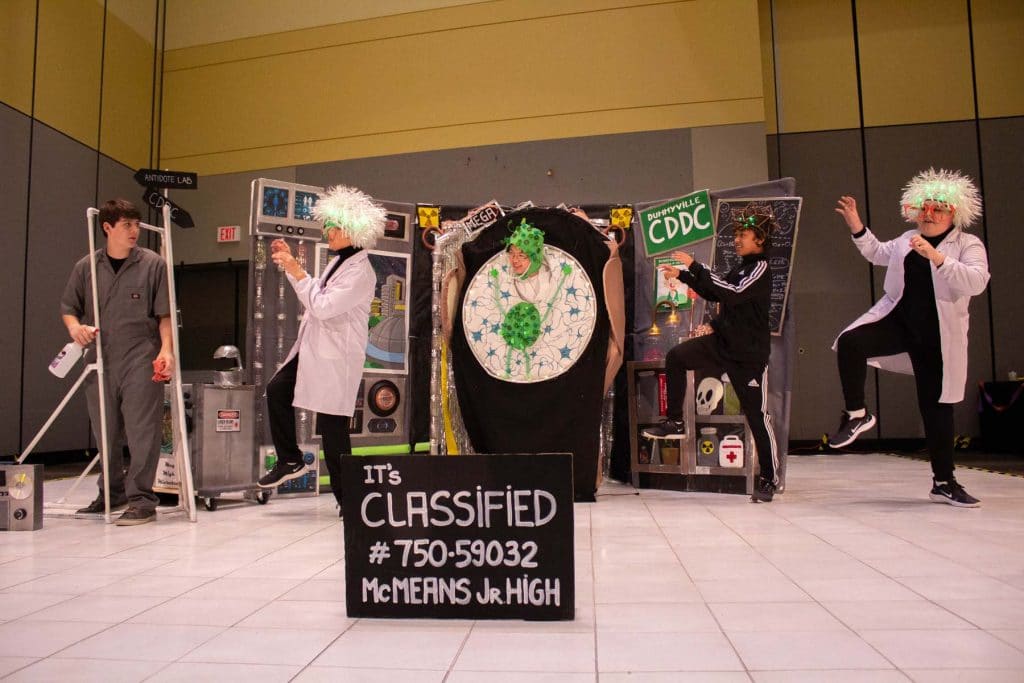 Students participating in a challenge during a Destination Imagination tournament