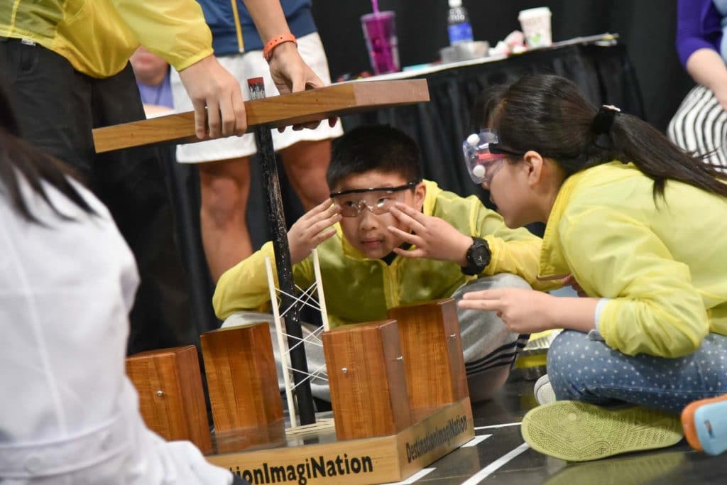 Students participating in a challenge during a Destination Imagination tournament