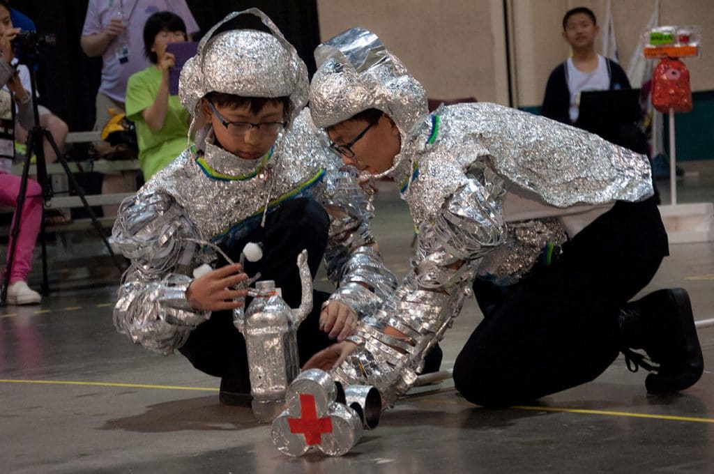 Students participating in a Destination Imagination tournament challenge