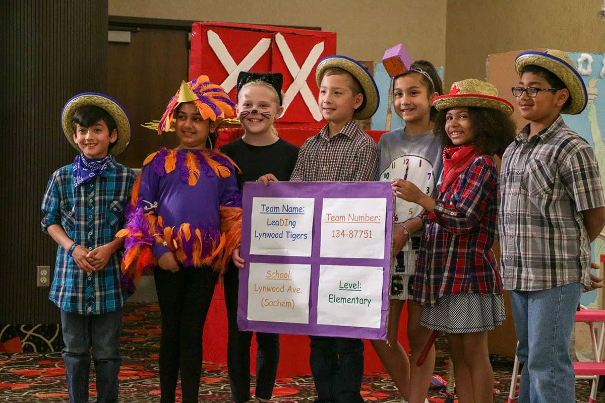 Students posing for a photo at a Destination Imagination tournament