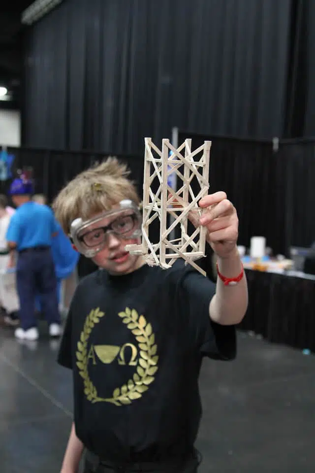 Student showing if prop to the camera during a Destination Imagination tournament