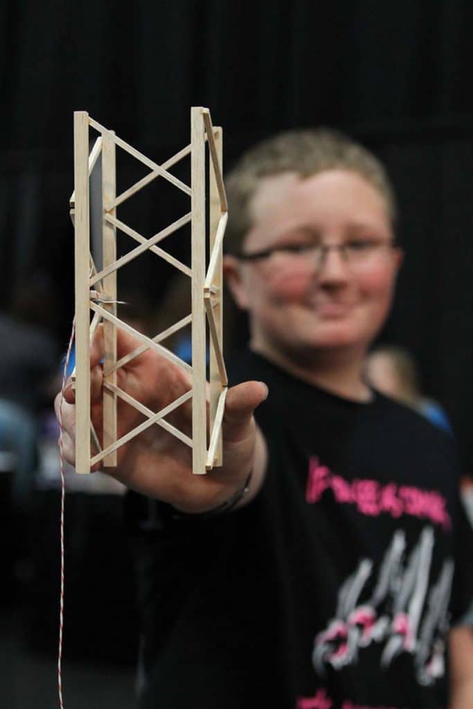 Student showing his prop to the camera during a Destination Imagination tournament